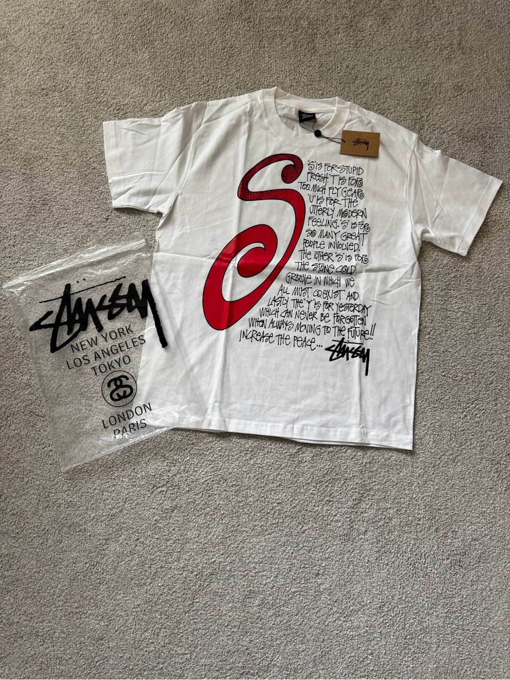 Stussy White Tee with Red and Black Graphic 'S'